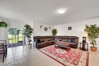 Living area featuring light tile patterned floors