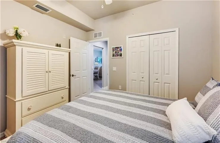 Bedroom featuring ceiling fan, a closet, and carpet floors