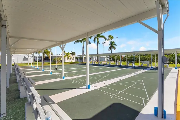 View of community featuring shuffleboard