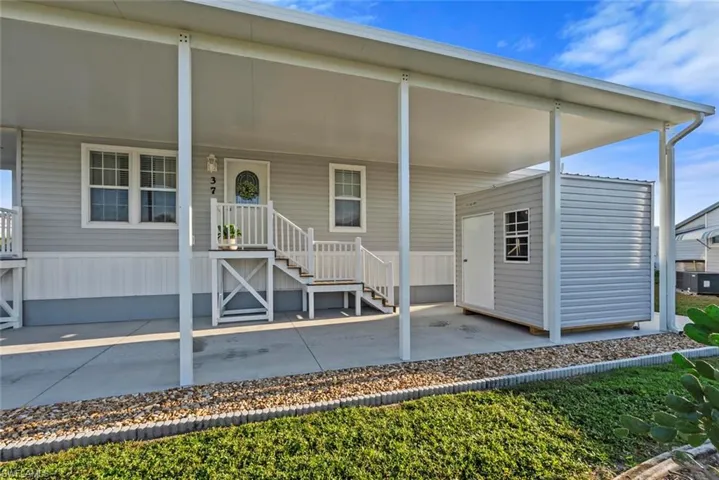 Doorway to property featuring a porch