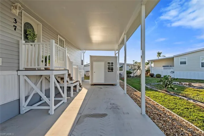 View of patio featuring a storage shed