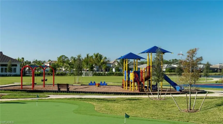 Community jungle gym with a yard