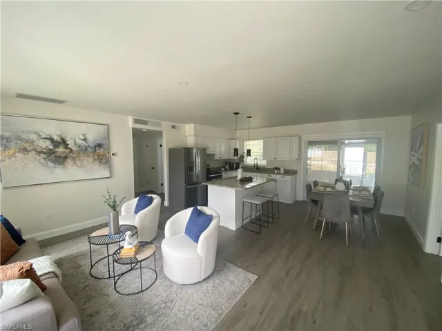 Living area featuring wood finished floors and baseboards