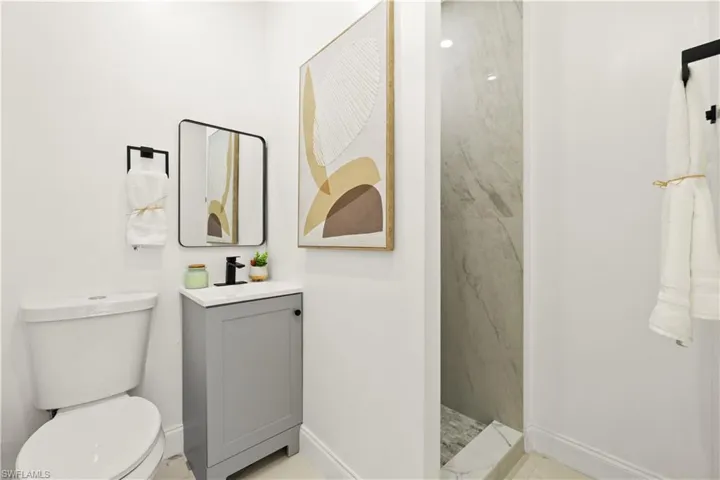 Bathroom with vanity and a walk in shower