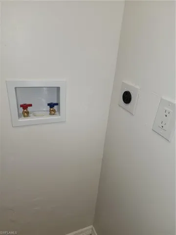 Washroom with washer hookup and hookup for an electric dryer