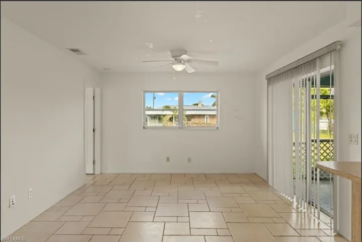 Spare room with ceiling fan