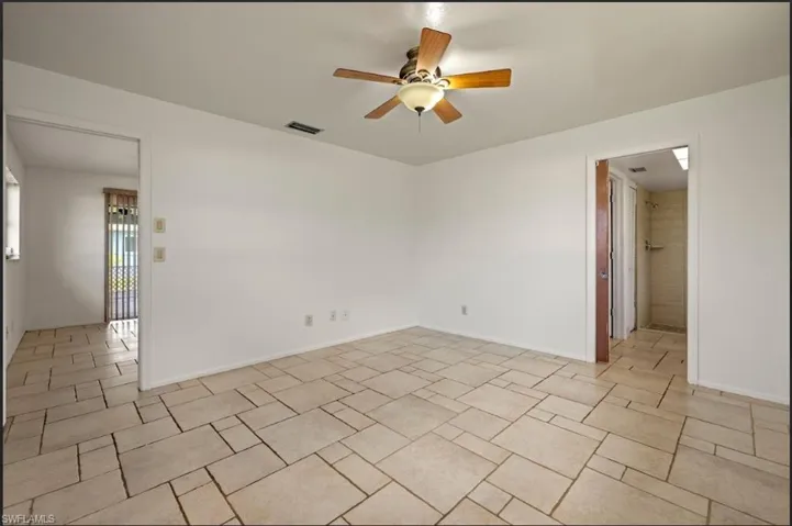 Spare room with ceiling fan