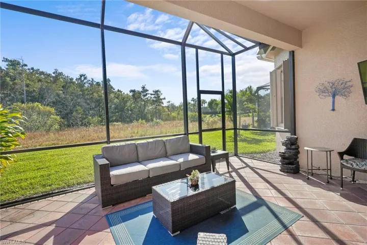 Sunroom / solarium with an outdoor living space and a patio