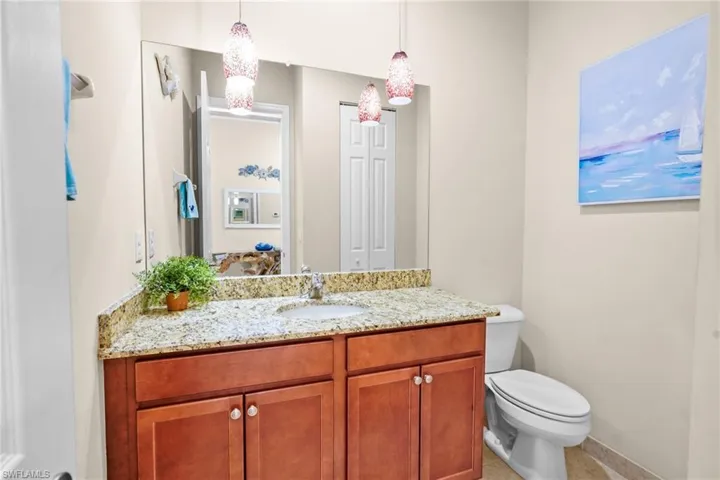 Bathroom featuring vanity and toilet