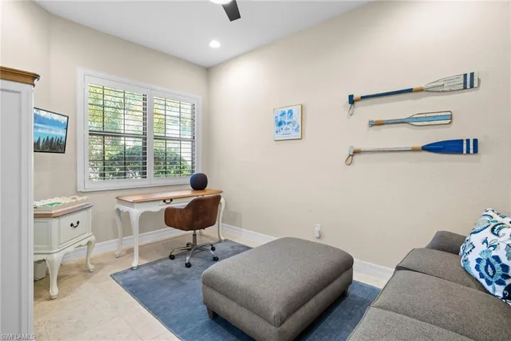 Office with baseboards and recessed lighting