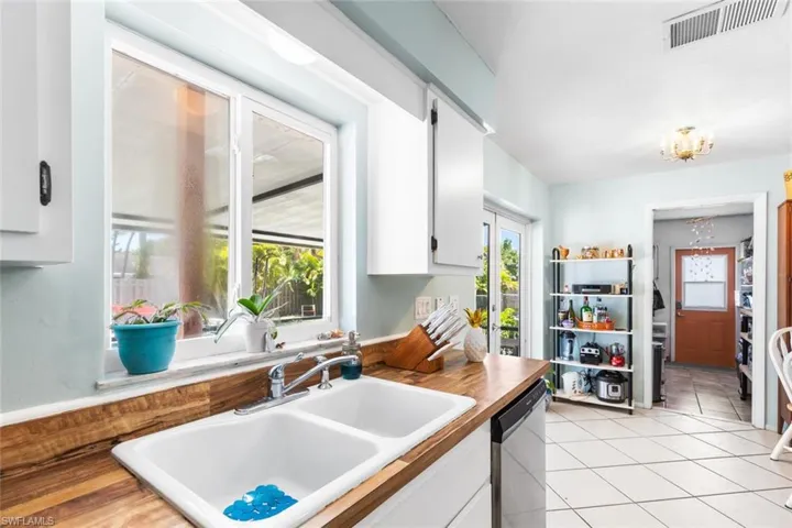Kitchen Pantry / Mud Room with side door to driveway