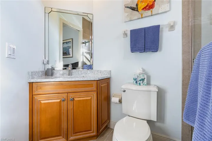 WEST-FACING GUEST BATH.  QUARTZ TOPPED VANITY.