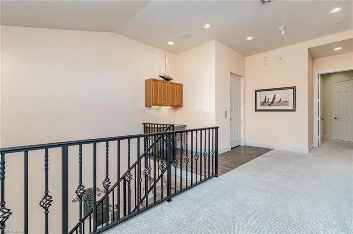LOFT AREA.  DOOR (MIDDLE) IS THE ELEVATOR.  DOOR AT RIGHT LEADS TO OWNER'S SUITE.