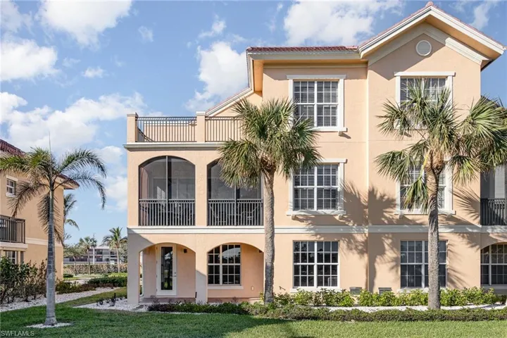 REAR OF HOME SHOWING LOWER LEVEL LOGGIA (ACCESSED THROUGH THE GARAGE, MAIN LIVING AREA SCREENED LANAI AND OPEN TERRACE OFF OWNER'S SUITE.
