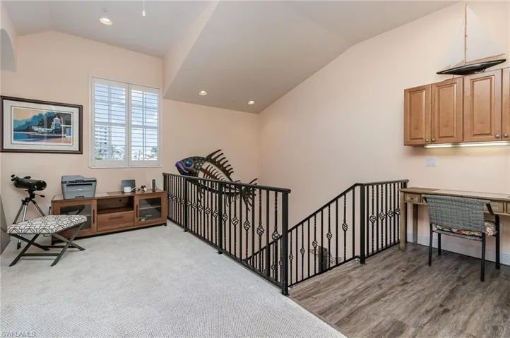 WEST-FACING UPSTAIRS LOFT AREA WITH BUILT-IN CABINETRY.   RECESSED LIGHTING.