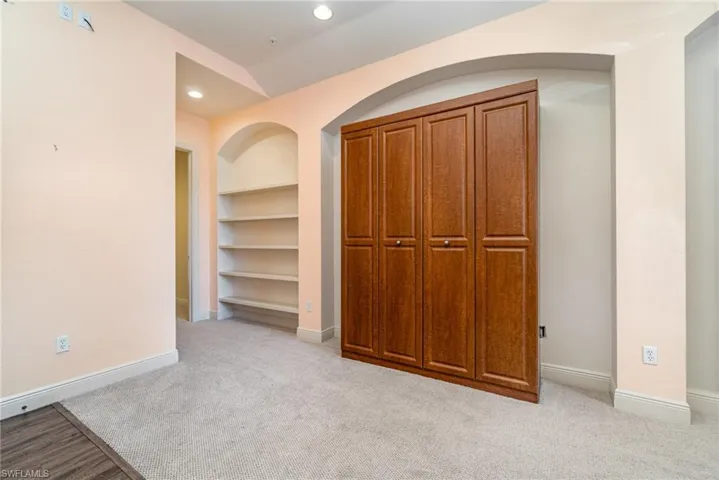 BUILT-IN WALL BED.  ENTRANCE TO OWNER'S SUITE IS TO LEFT.