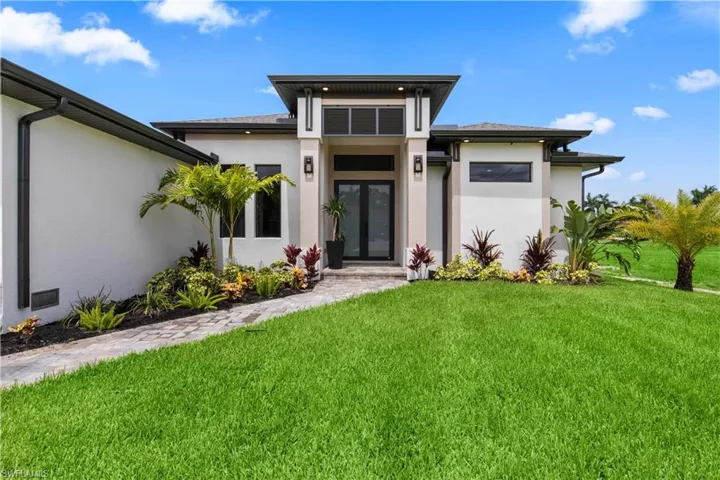 View of front of home featuring a front lawn