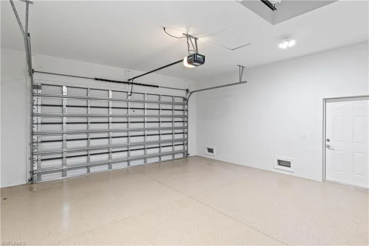 Garage featuring a garage door opener