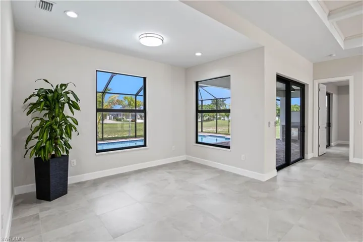 Spare room with light tile patterned flooring and french doors