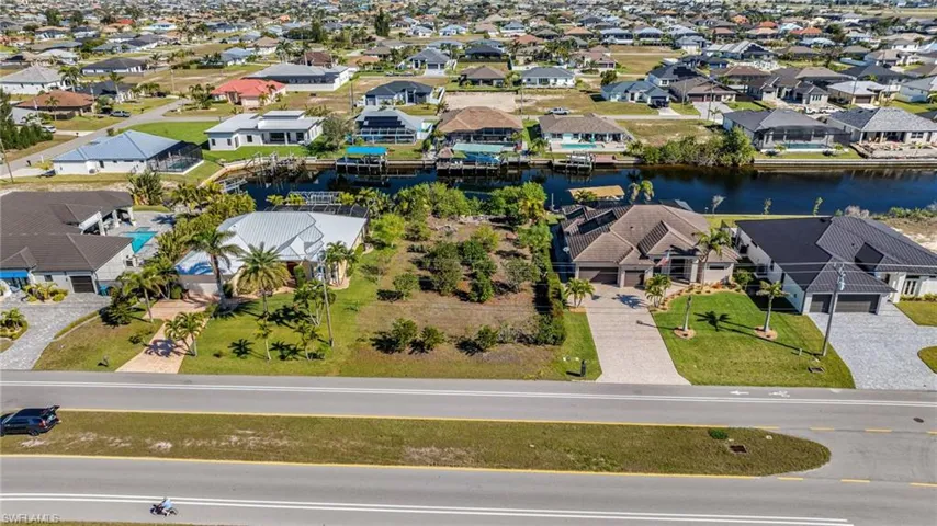 Aerial view with a residential view and a water view