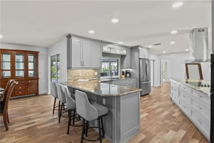 Spacious kitchen with large center island, ideal for gatherings and everyday living.