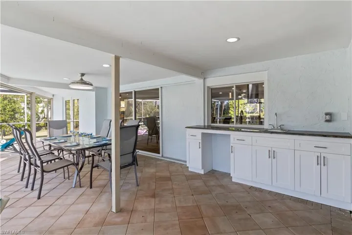 Outdoor entertaining made easy with a wet bar and direct kitchen access.