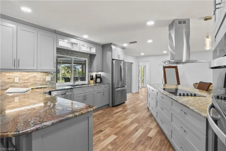 Chef’s dream kitchen featuring an oversized island, custom cabinetry, and high-end finishes.