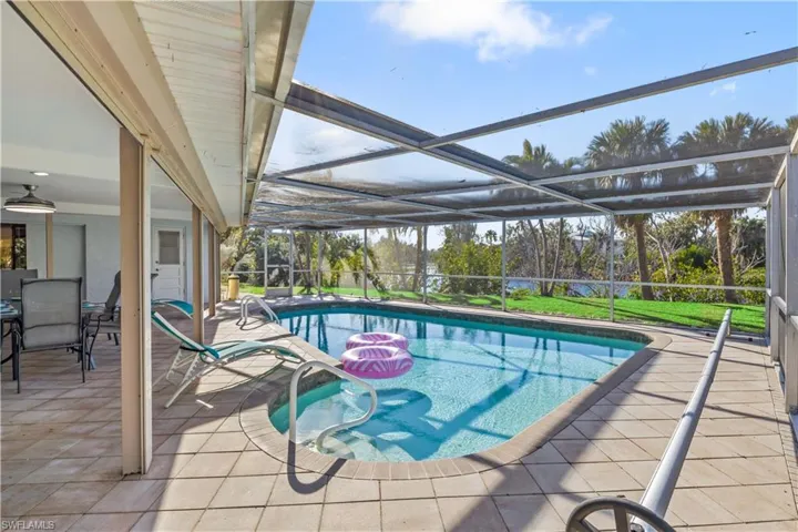 Beautiful outdoor pool area offering a private tropical retreat.