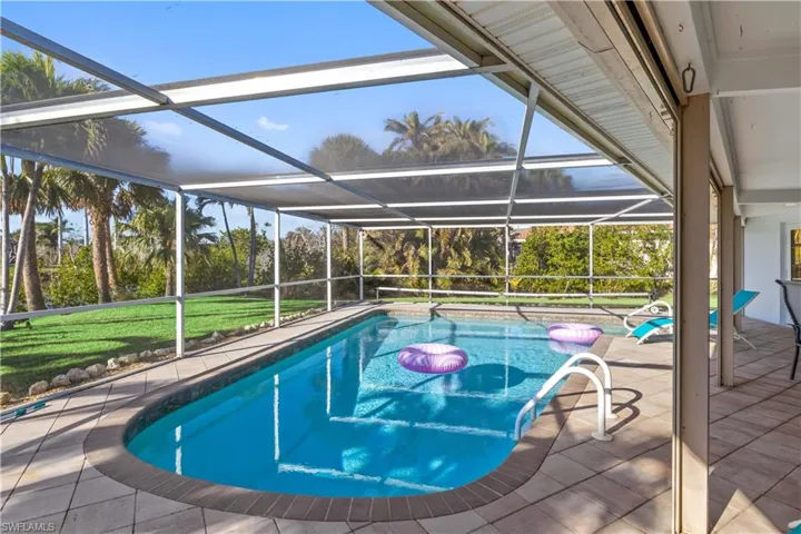 Sparkling pool surrounded by a spacious lanai—perfect for year-round enjoyment.