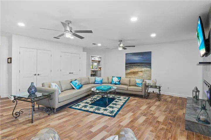 Expansive bonus room with fireplace, perfect for entertaining or creating your dream media space.
