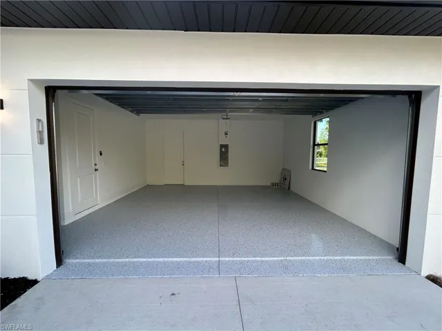 Garage featuring electric panel