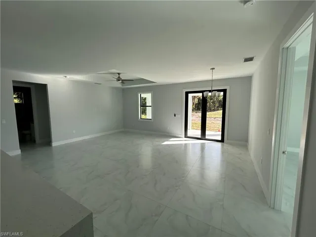 Unfurnished room featuring ceiling fan