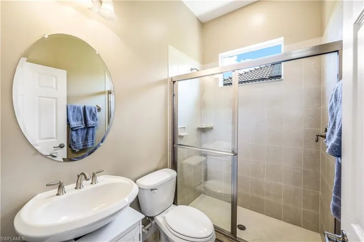 3rd Bathroom with vanity, toilet, and a walk in shower is located right outside the 4th bedroom door.  This also serves as your pool bath.
