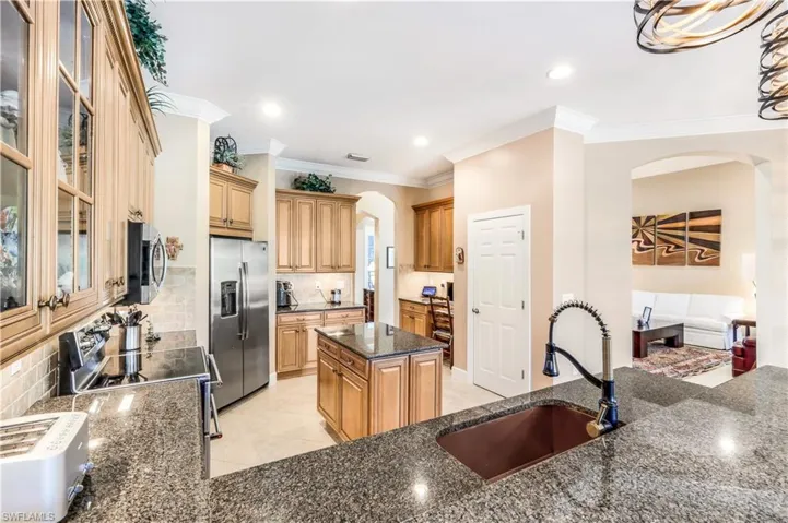 Kitchen also offers a work space and a pantry. New copper farm sink.