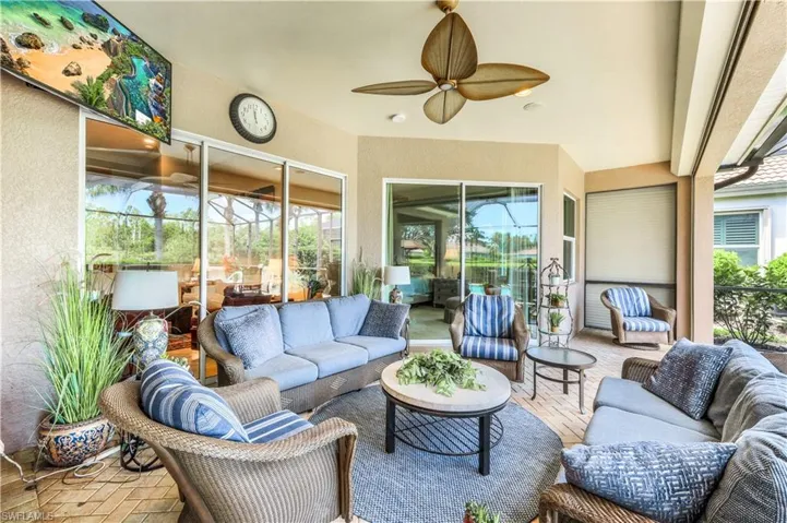 Sunroom featuring ceiling fan