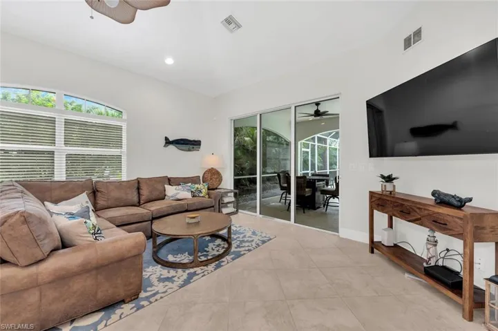 Tiled living room with ceiling fan