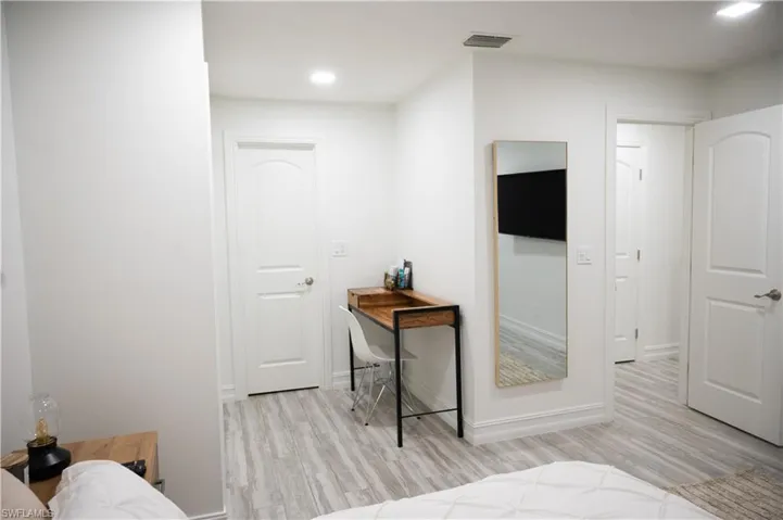 Bedroom featuring light wood-style flooring and recessed lighting