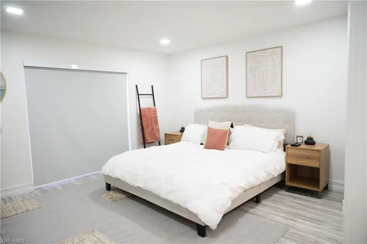 Bedroom featuring light wood-style floors and recessed lighting