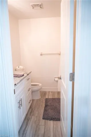 Bathroom with vanity and light wood-type flooring