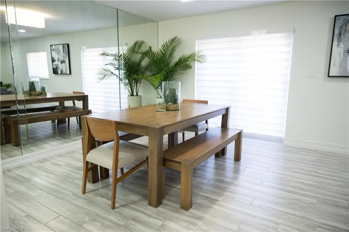 Dining space featuring wood finish floors and baseboards