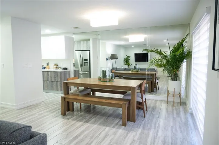 Dining room featuring light wood-style flooring and recessed lighting