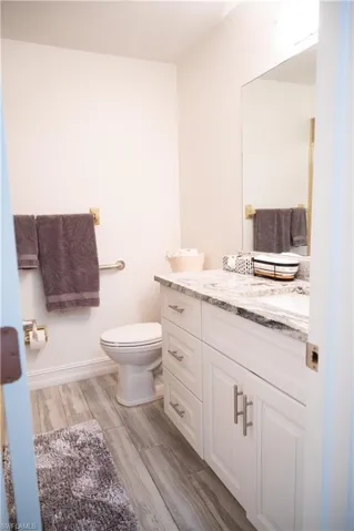 Bathroom featuring vanity and wood tiled floors