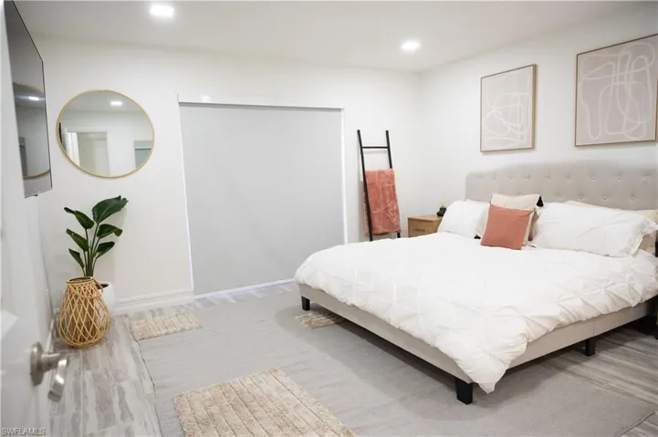Bedroom with recessed lighting and light wood-style floors