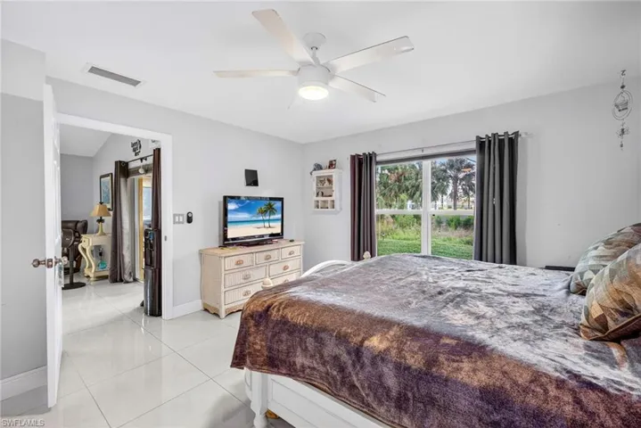 Bedroom featuring ceiling fan and light tile patterned floors