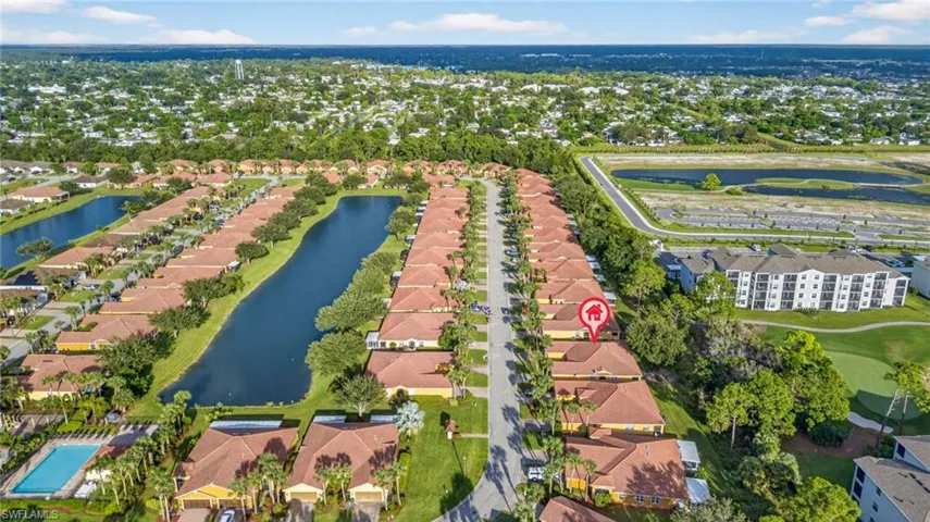 Aerial perspective of suburban area with a large body of water