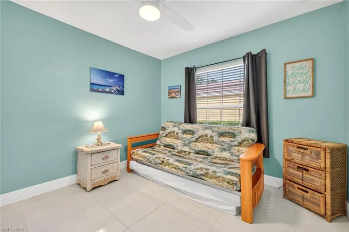 Bedroom featuring ceiling fan and light tile patterned floors
