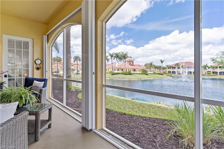 Sunroom with a water view