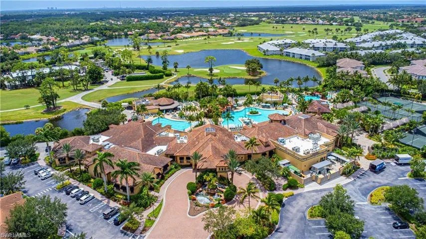 Aerial view of property's location with a nearby body of water and nearby suburban area
