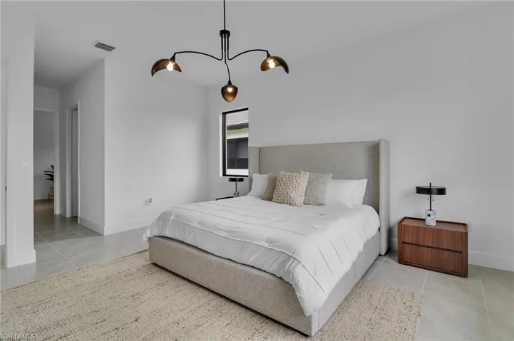 Bedroom featuring light tile patterned flooring