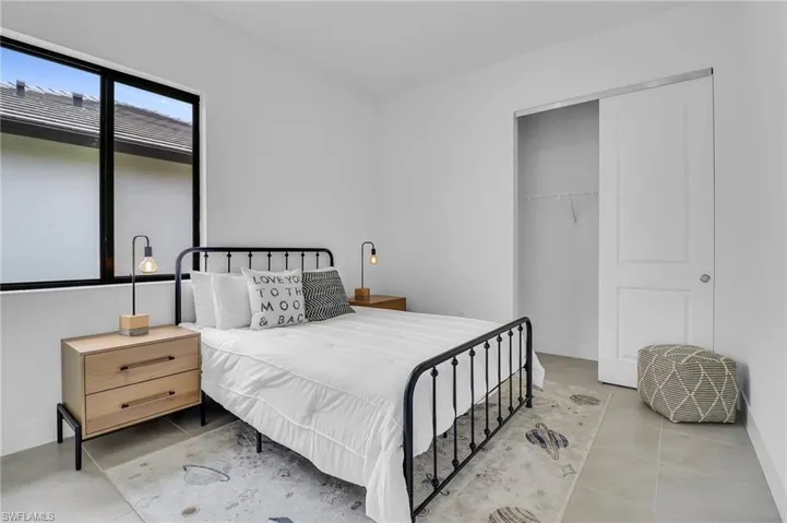 Tiled bedroom with a closet